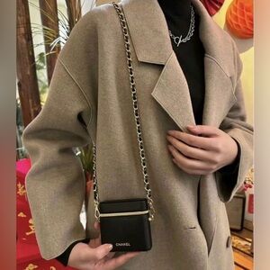 CHANEL Black Mini Chain Cosmetic Case with Gold Accents